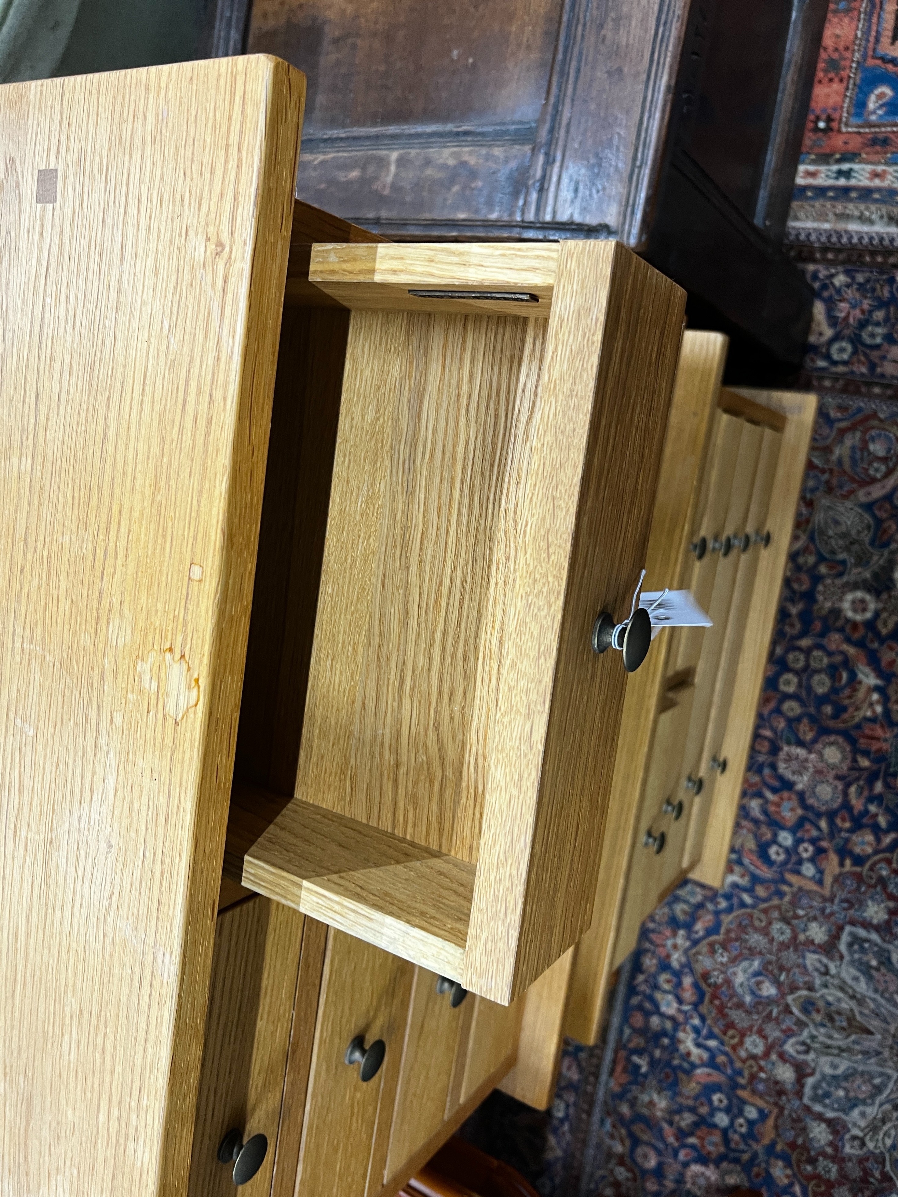 A pair of contemporary Laura Ashley Garrat oak six drawer bedside chests, width 63cm, depth 50cm, height 53cm